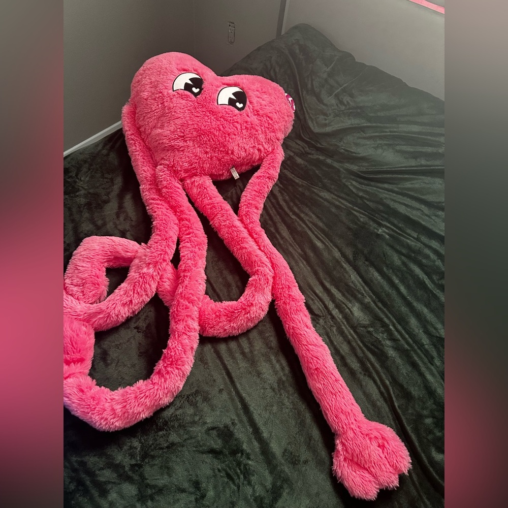 Five below pink heart with arms and legs